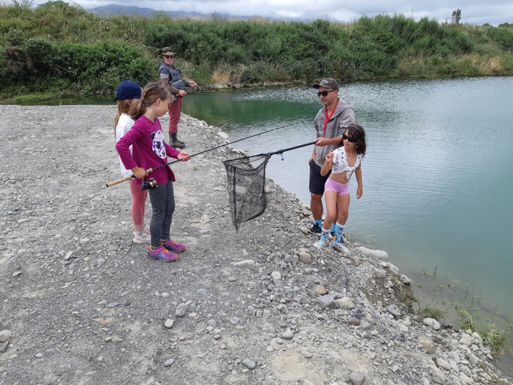 Young women being introduced to angling at the Kapiti Fly Fishing Club's Kids Fish Out Day in 2022.